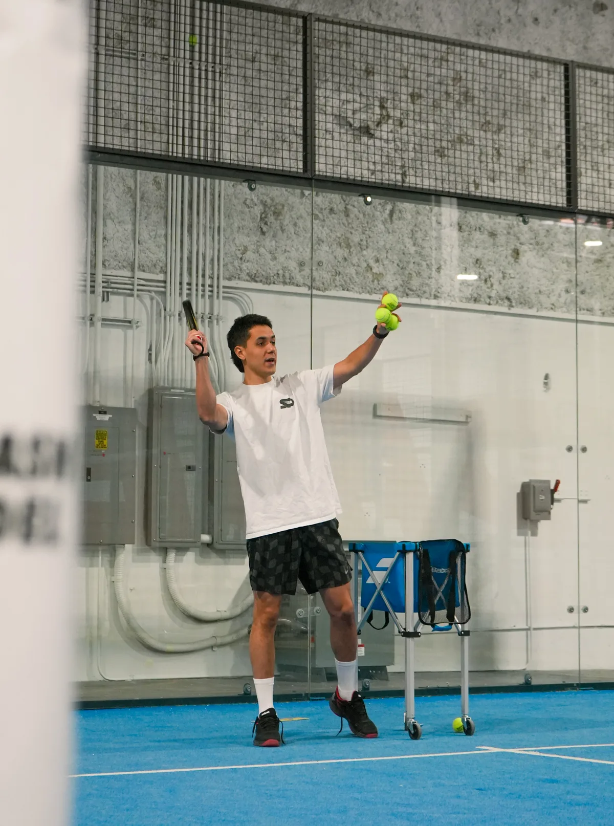 A Smash Padel coach explaining the game on court